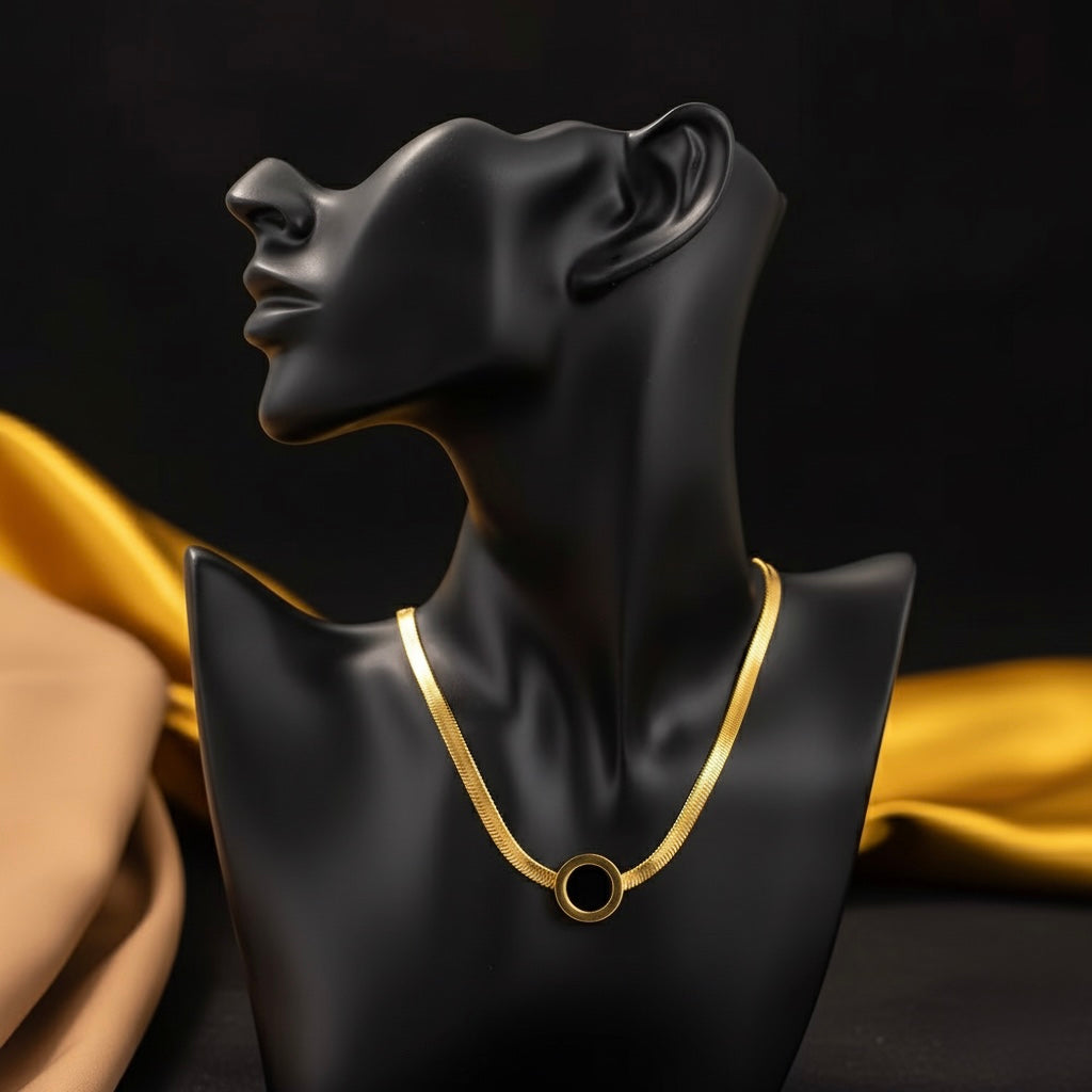 Elegant Gold Herringbone Chain Necklace with Black Enamel Circle Pendant