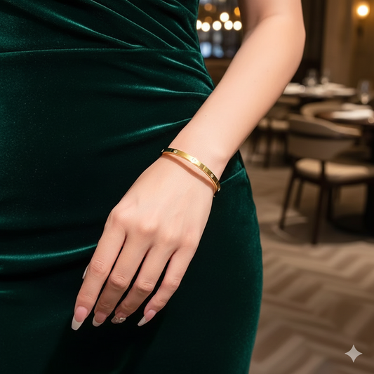 Classic Elegance - A golden bangle adorned with sparkling stones – a timeless piece that adds sophistication to every look.